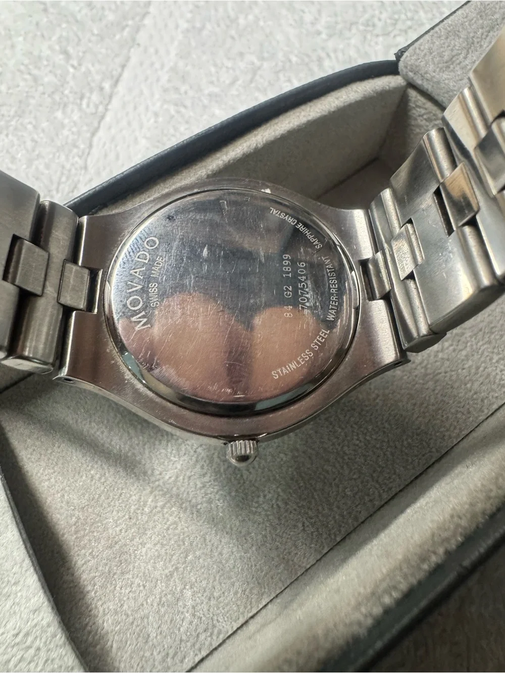 #119 Movado Men's Stainless Steel Watch with Black Dial and Silver Bracelet